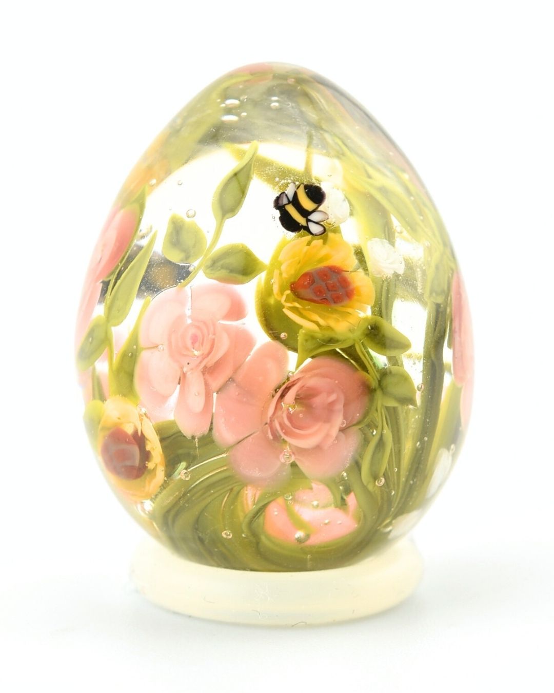 Oeufs roses pêche, tournesols et abeilles