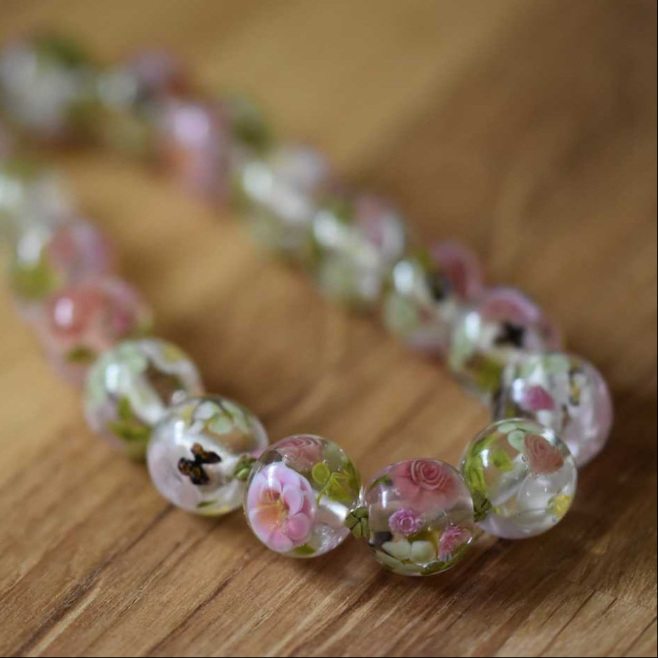 Necklace with glass peonies, roses and butterflies by Kathryn Greer