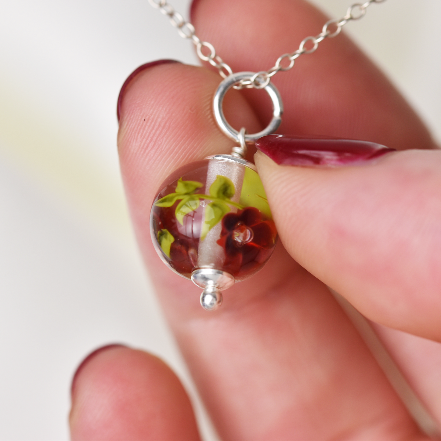 Necklace with burgundy glass flowers