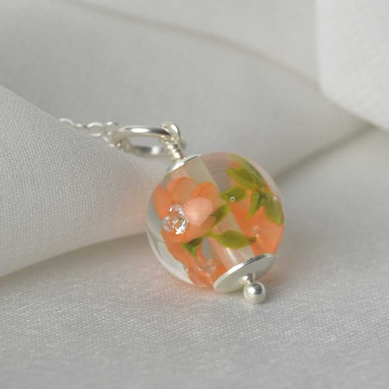 Necklace with apricot glass flowers