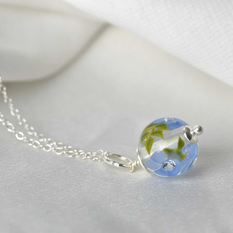 Necklace with periwinkle glass flowers
