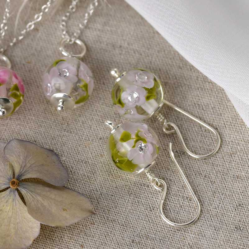 Necklace with magnolia glass flowers
