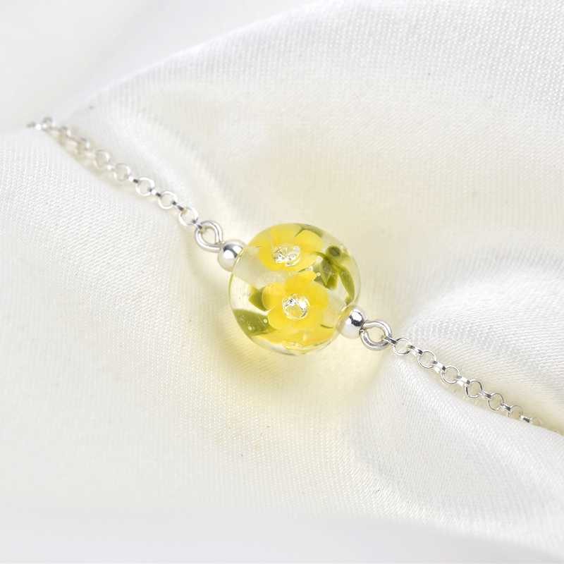 Bracelet aux boutons d'or de verre